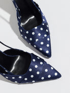 Moncelia navy polka dot satin slingbacks, close-up of pointed toe and black lining, women's sizes 5 to 12