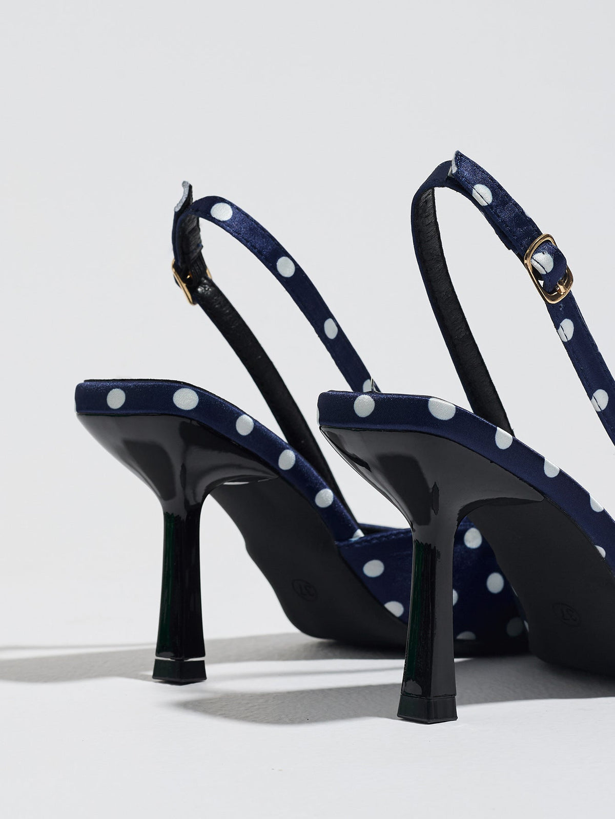 Moncelia navy polka dot satin slingbacks, back view showing heels and buckled straps, women's sizes 5 to 12