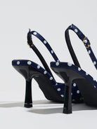 Moncelia navy polka dot satin slingbacks, back view showing heels and buckled straps, women's sizes 5 to 12