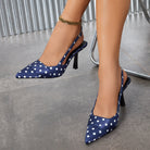 Moncelia navy polka dot satin slingbacks, worn on model with ankle chain, women's sizes 5 to 12