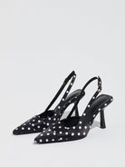 Moncelia black polka dot satin slingbacks, pair shown from the side with white dots, women's sizes 5 to 12