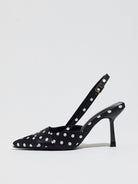 Moncelia black polka dot satin slingbacks, single shoe in profile showing slim heel, women's sizes 5 to 12