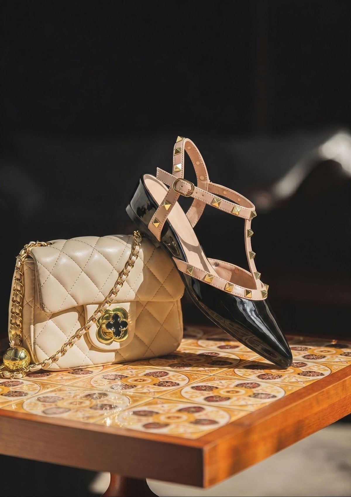 Moncelia black studded T-strap flats, patent pair styled with a quilted handbag, women's sizes 5 to 10.5