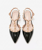Moncelia black studded T-strap flats, pair shown from above with gold studs, women's sizes 5 to 10.5