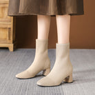 Moncelia apricot knit sock ankle boots, front view on model with a midi skirt, women's sizes 5.5 to 12