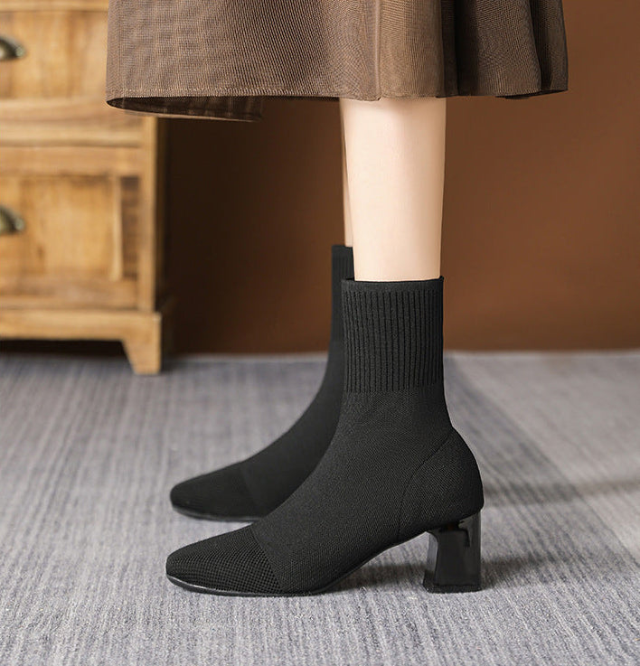 Moncelia black knit sock ankle boots, front view on model, square toe in focus, women's sizes 5.5 to 12
