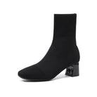 Moncelia black knit sock ankle boots, single boot in profile showing block heel, women's sizes 5.5 to 12