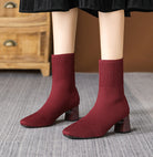 Moncelia burgundy knit sock ankle boots, pair worn standing, square toe in focus, women's sizes 5.5 to 12