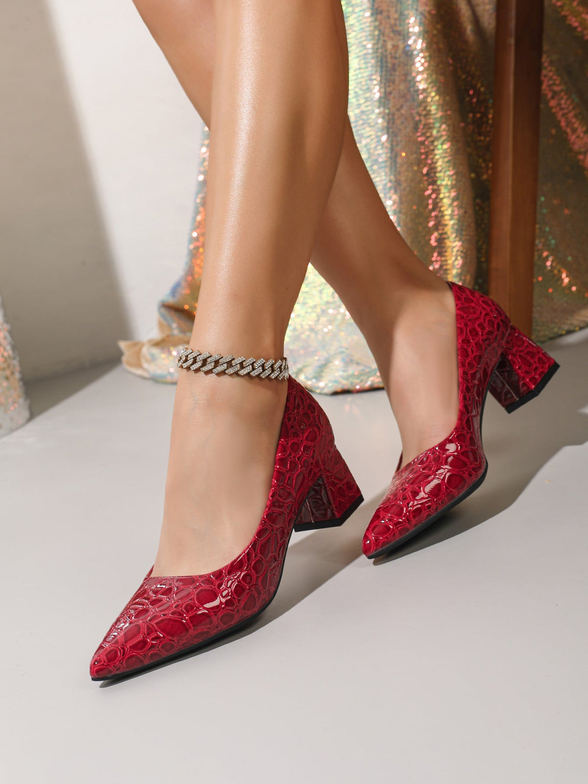 Moncelia burgundy croc-embossed block heel pumps, side view on model while walking, women's sizes 5.5 to 12