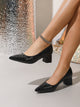 Moncelia black croc-embossed block heel pumps, front view on model with chain anklet, women's sizes 5.5 to 12