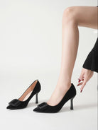 Moncelia black folded plate pointed toe pumps, worn slipping on one shoe, women's sizes 5.5 to 10.5