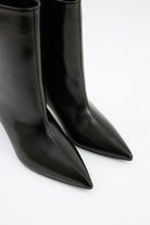 Moncelia black pointed toe kitten heel booties, close-up of pull-on shaft and toe, women's sizes 5 to 12