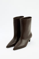 Moncelia brown pointed toe kitten heel booties, pair shown at an angle, women's sizes 5 to 12