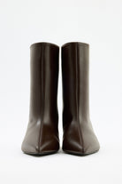 Moncelia brown pointed toe kitten heel booties, pair shown from the front, women's sizes 5 to 12