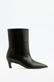 Moncelia black pointed toe kitten heel booties, single bootie in profile showing heel, women's sizes 5 to 12