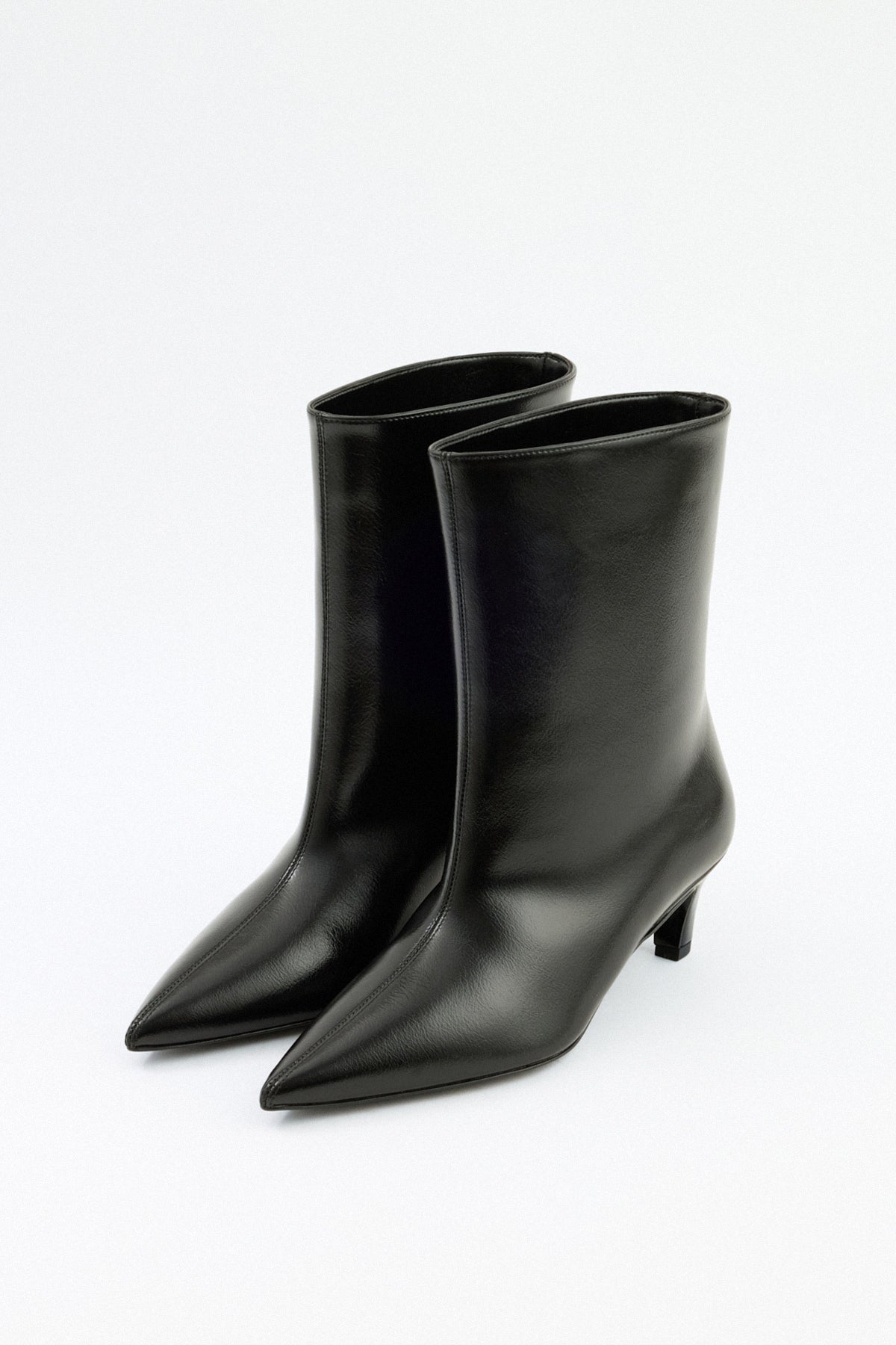 Moncelia black pointed toe kitten heel booties, pair shown at an angle, women's sizes 5 to 12