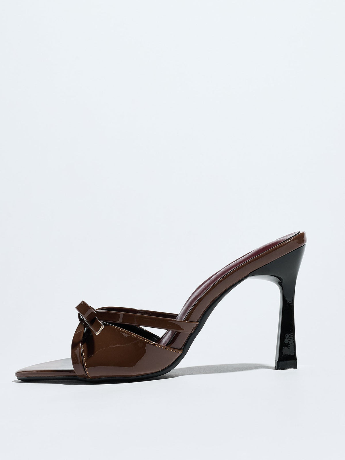 Moncelia brown bow pointed toe heeled mules, single mule in profile showing heel, women's sizes 5 to 12