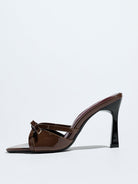 Moncelia brown bow pointed toe heeled mules, single mule in profile showing heel, women's sizes 5 to 12