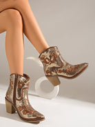 Moncelia gold sequin western ankle boots, worn seated with legs crossed, side view, women's sizes 5.5 to 12