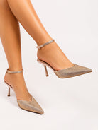 Moncelia champagne crystal paved pointed toe mules, worn on model with ankle strap, women's sizes 5 to 11.5