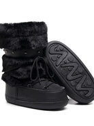 Moncelia black faux fur studded platform snow boots, close-up of lug sole tread, women's sizes 5.5 to 9