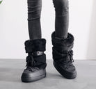 Moncelia black faux fur studded platform snow boots, front view on model with jeans, women's sizes 5.5 to 9