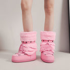 Moncelia pink faux fur snow boots, front view on model showing lug platform sole, women's sizes 5.5 to 9