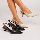 Moncelia black and apricot pointed toe slingback spool heels, worn on model together, women's sizes 5 to 11.5